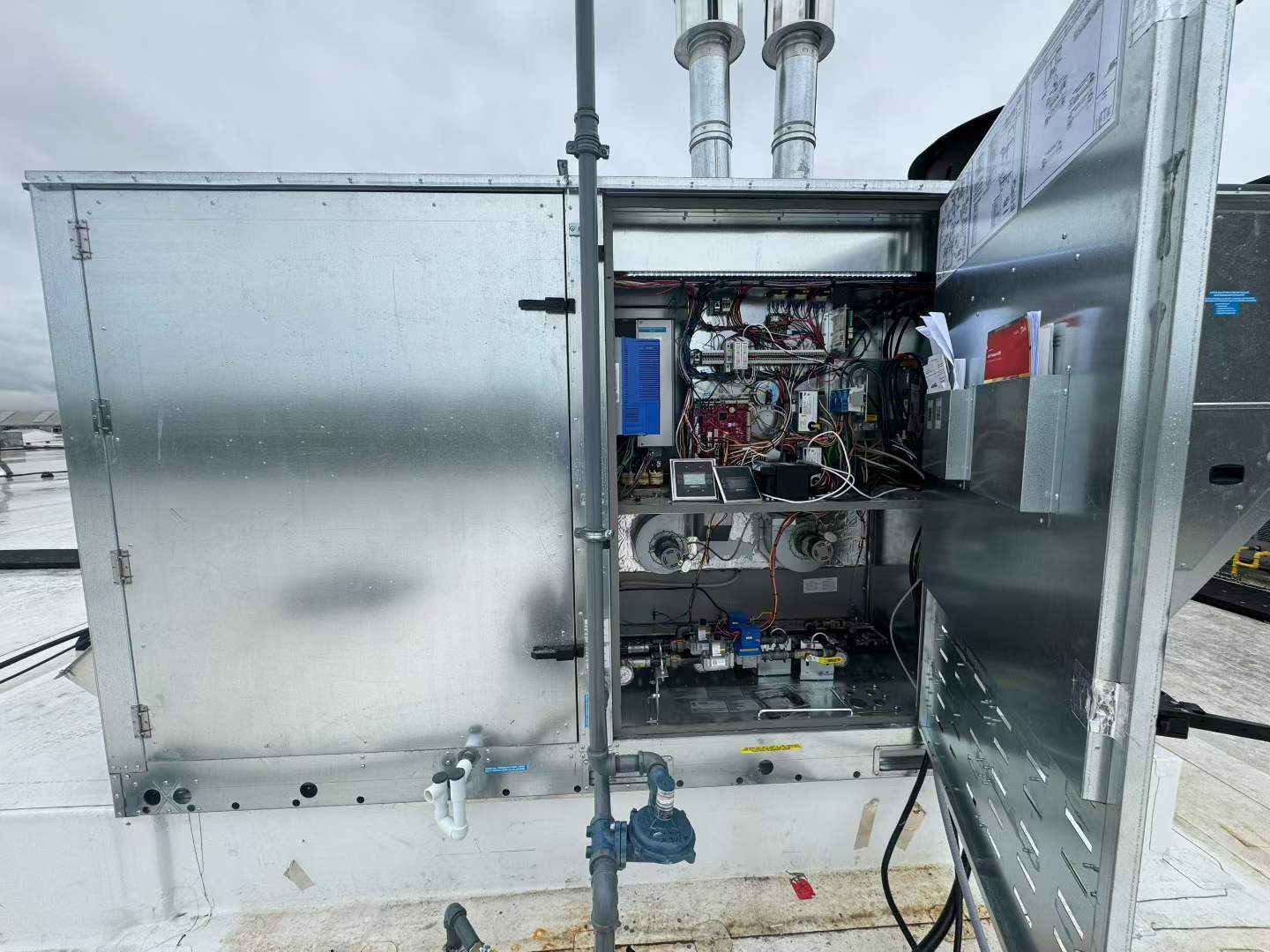 Open service panel on commercial rooftop HVAC unit
